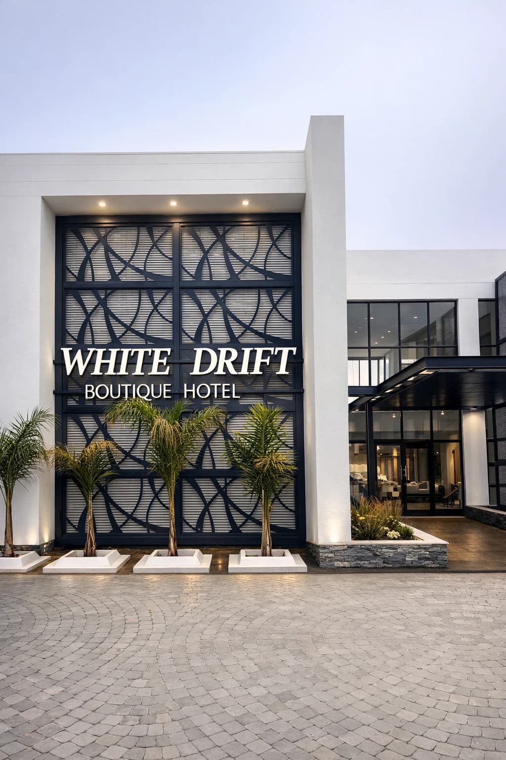 Elegant exterior entrance of White Drift Boutique Hotel